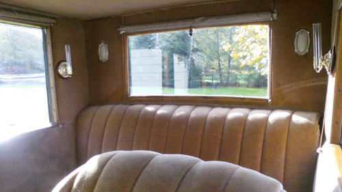 Backseat view of a 1923 Cadillac coupe.