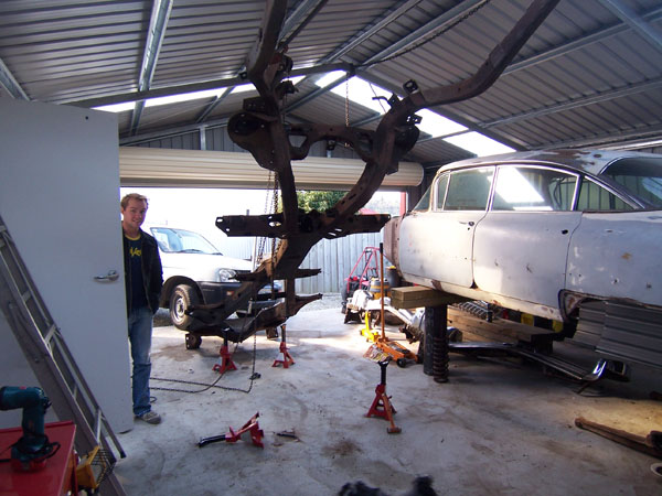 Cadillac frame sitting next to the 1959 Cadillac body.