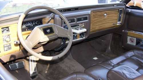 Interior of a 1982 cadillac fleetwood brougham including the 8 track tape.