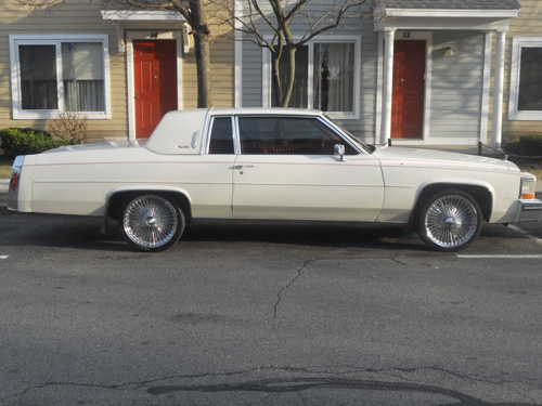 passenger side of a 1984 Cadillac with nice spoked rims