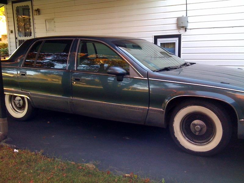 1994 Cadillac parked in a carport