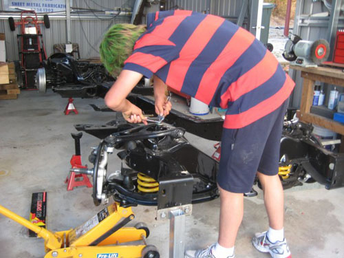 Blair applying pressure as he adjust the lower arms.