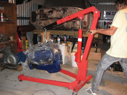 Blair moving the 1959 Cadillac into place with the engine crane.