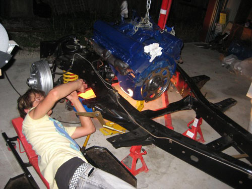 Blair lining up the engine on the frame.
