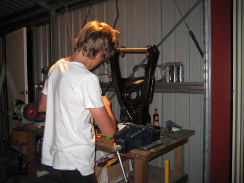 Blair helping install the ball joints on the 1959 Cadillac.