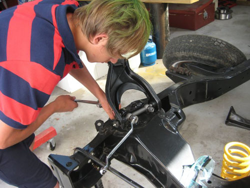 Replacing the upper control arm on the right hand side.