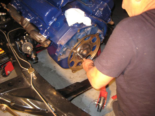Paul lining up the drive train while working on the engine.