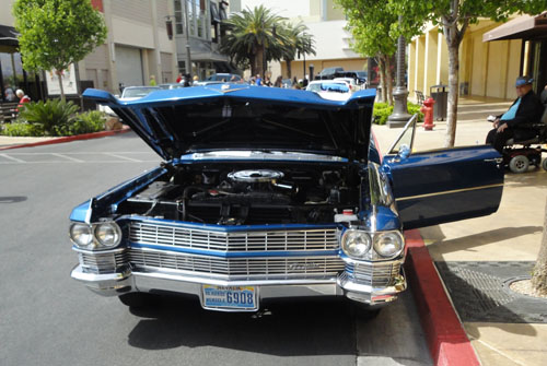 Hood open on a Cadillac convertible