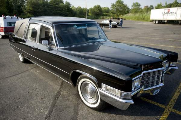 picture of a black Cadillac hearse at the car show in New Jersey