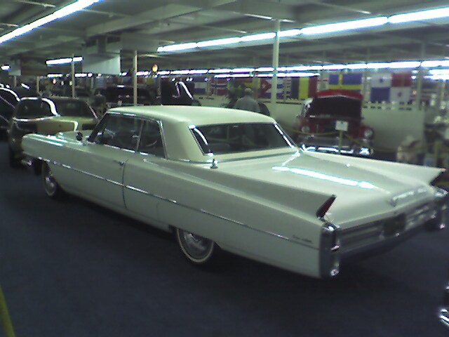 car that is over 40 years old rear view of a 1963 white cadillac coupe