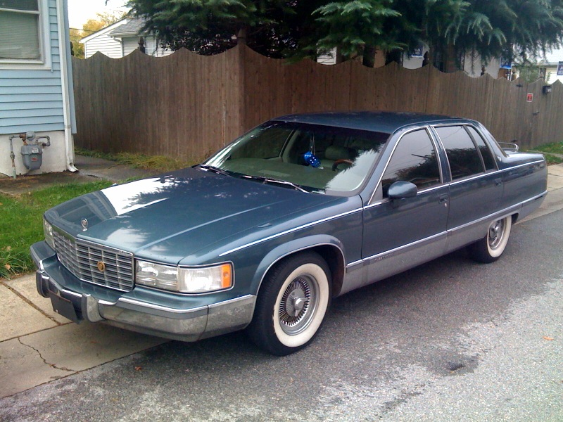 Picture of a 1994 Cadillac Fleetwood on a sidewalk