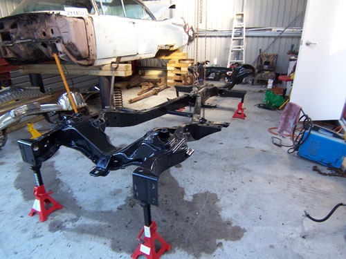 1959 cadillac chasis up on jack stands.