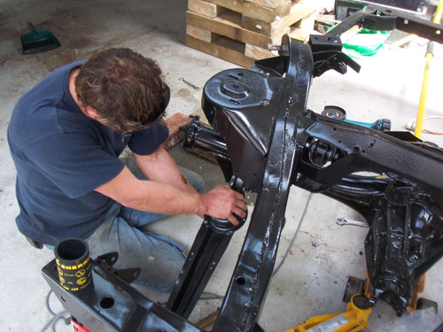 Paul replacing bushings on his cadillac.
