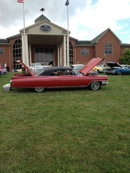 red cadillac on lawn