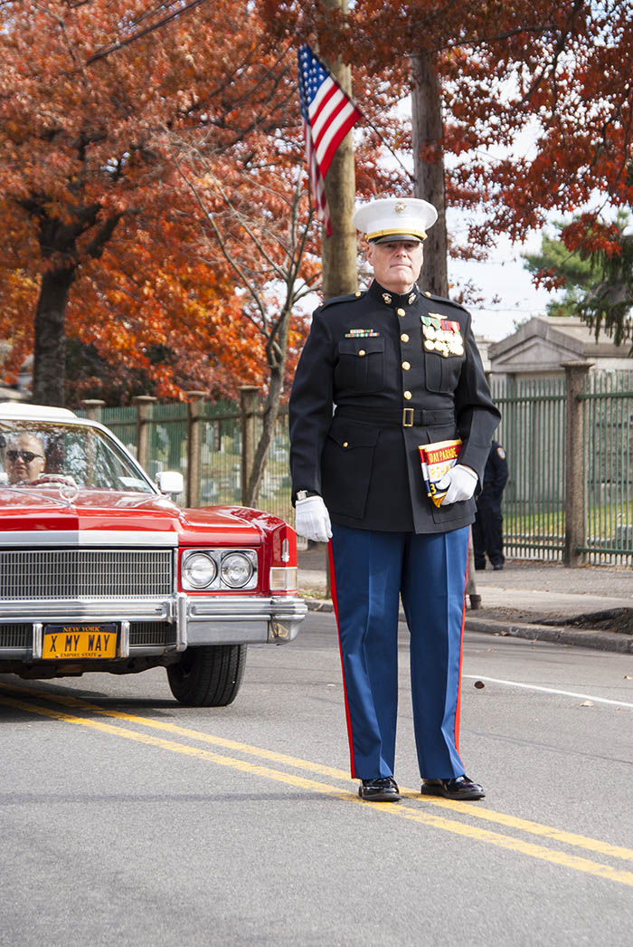 Marine standing outside of Cadillac